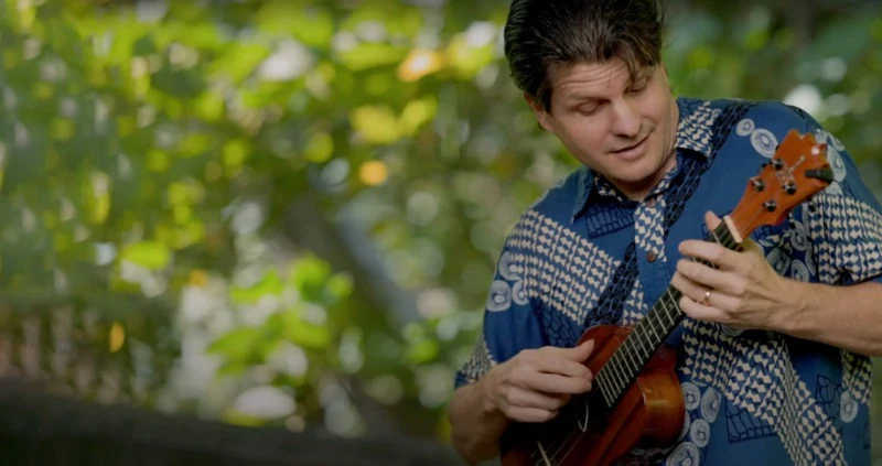 Jeff Peterson playing ukulele outdoors