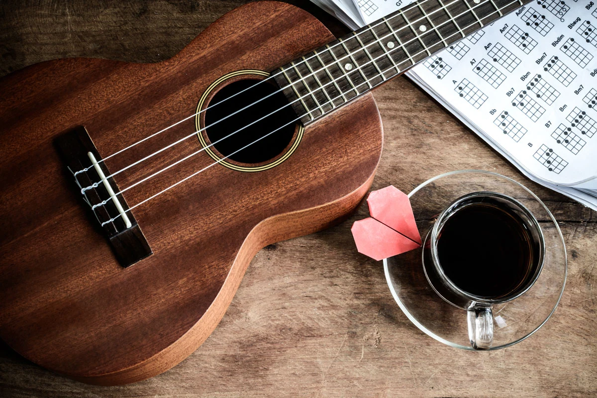 Ukulele and music ready for practice