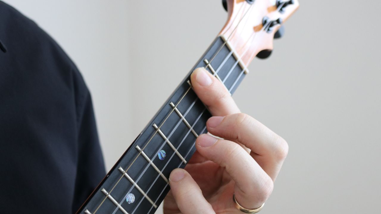 Photo of a barre or bar chord on ukulele