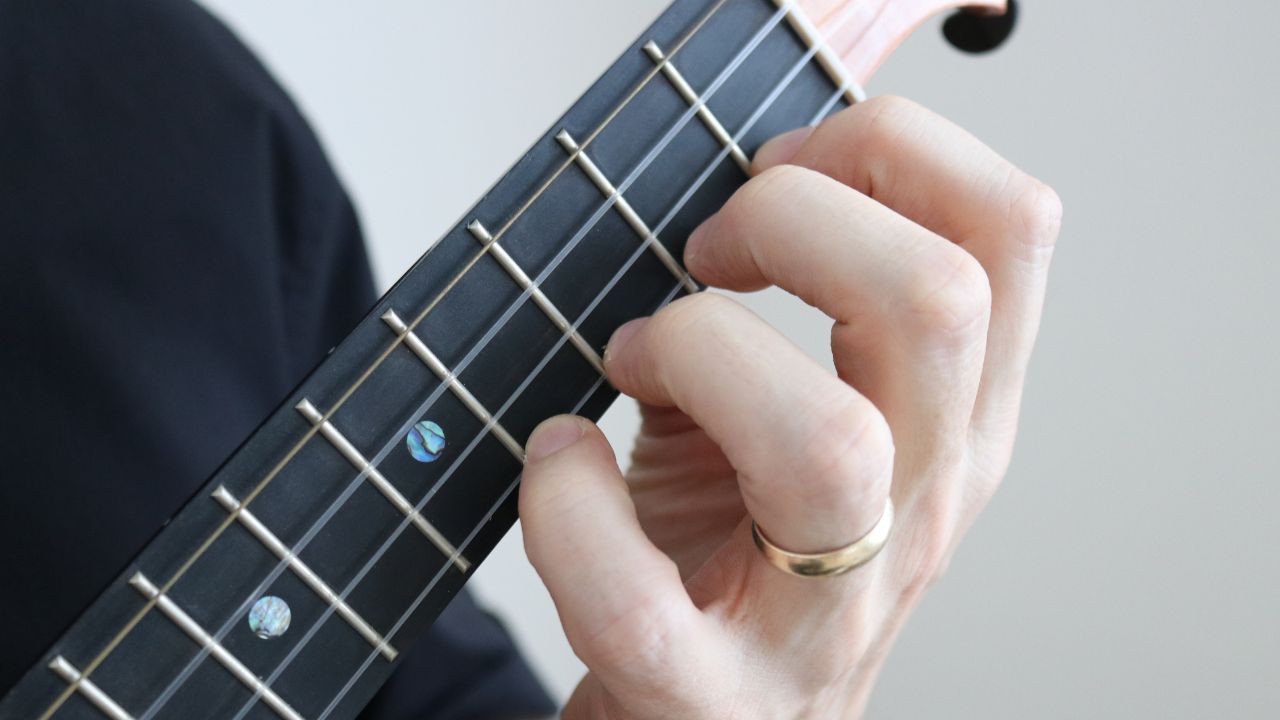 Photo of left-hand finger placement on ukulele